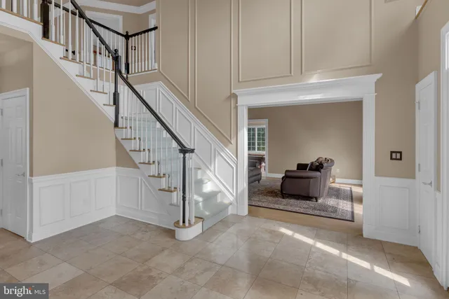 a bedroom with a bed and windows