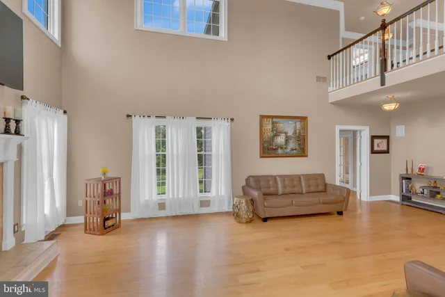 a bathroom with a granite countertop sink a toilet a mirror and bathtub