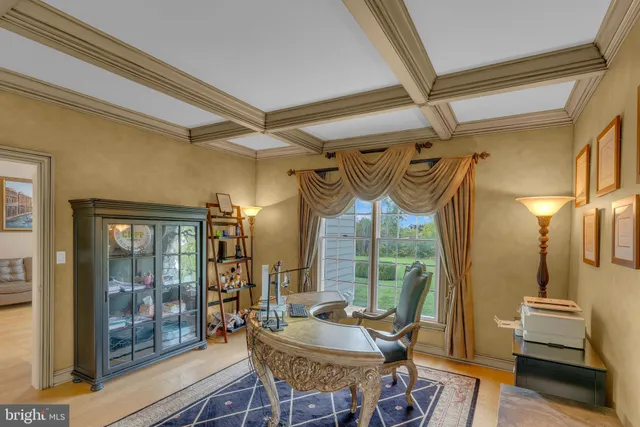 a view of an entryway with wooden floor and a rug