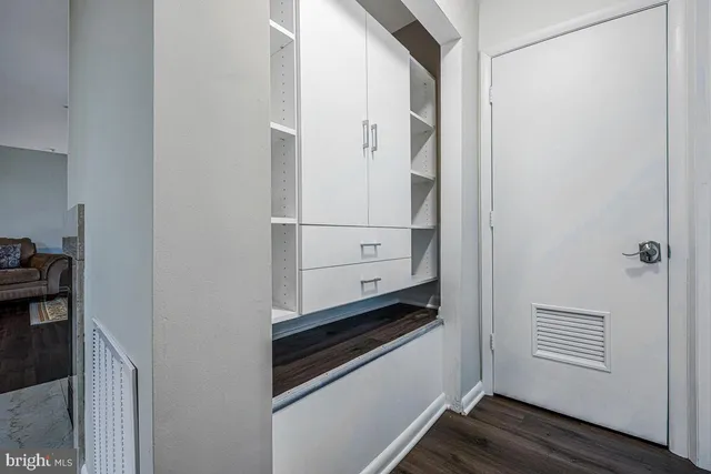 a view of a patio with table and chairs and potted plants