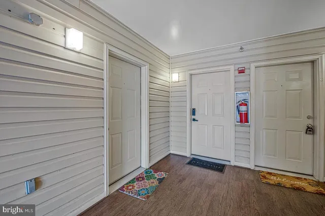 a living room with fireplace furniture and a wooden floor
