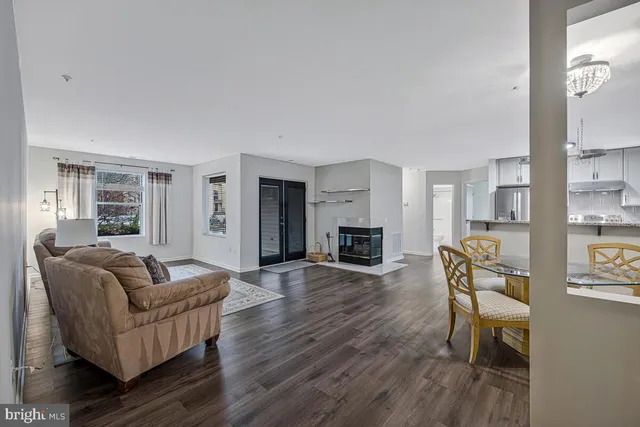 a kitchen with stainless steel appliances granite countertop a refrigerator sink and stove