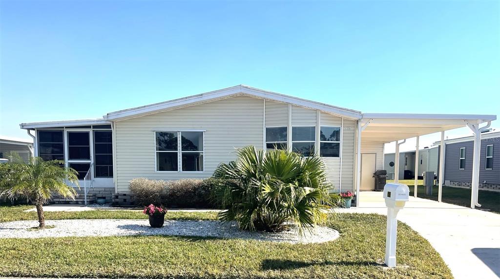 563 Portside Drive North Port, FL 34287 - Photo 1 of 1 a front view of a house with garden