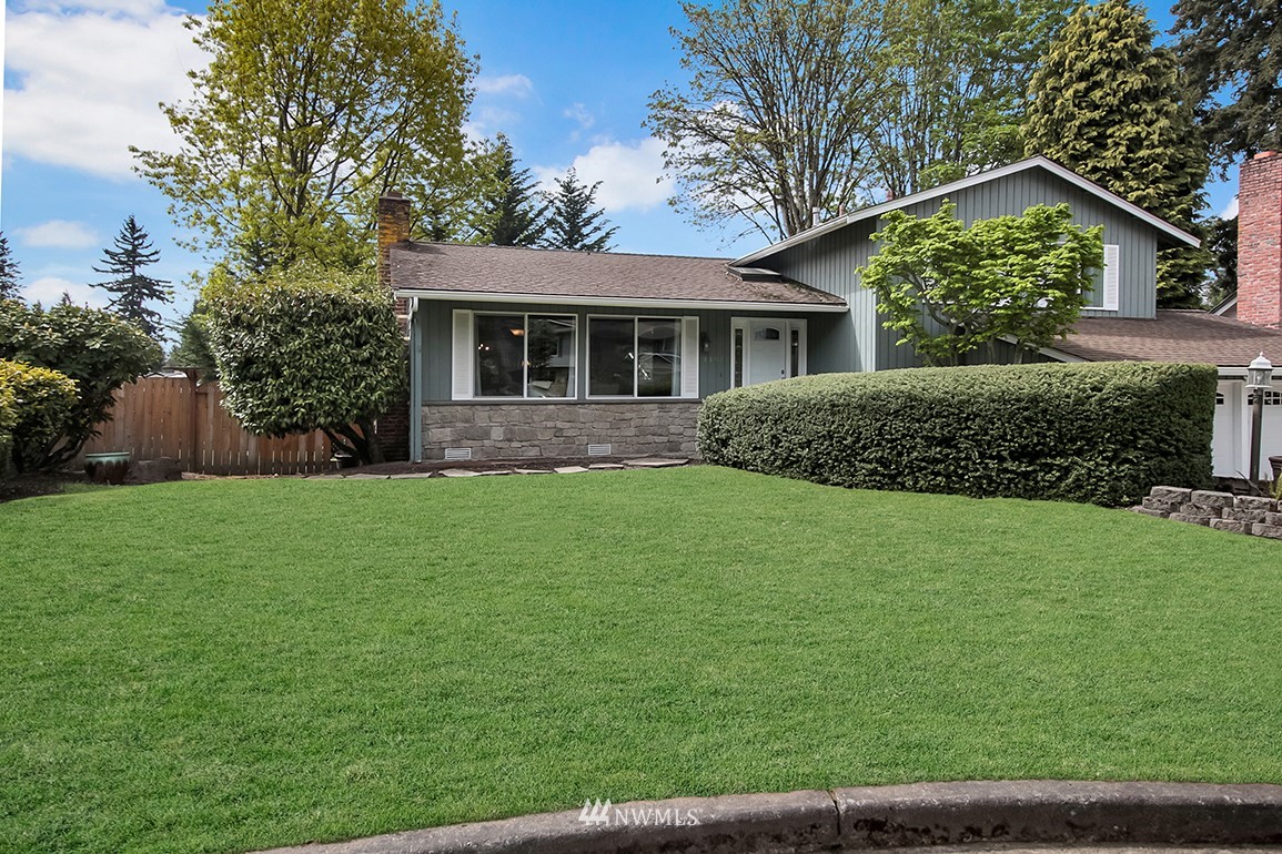 11811 Northeast 158th Street Bothell, WA 98011 - Photo 1 of 38 a front view of house with yard and green space