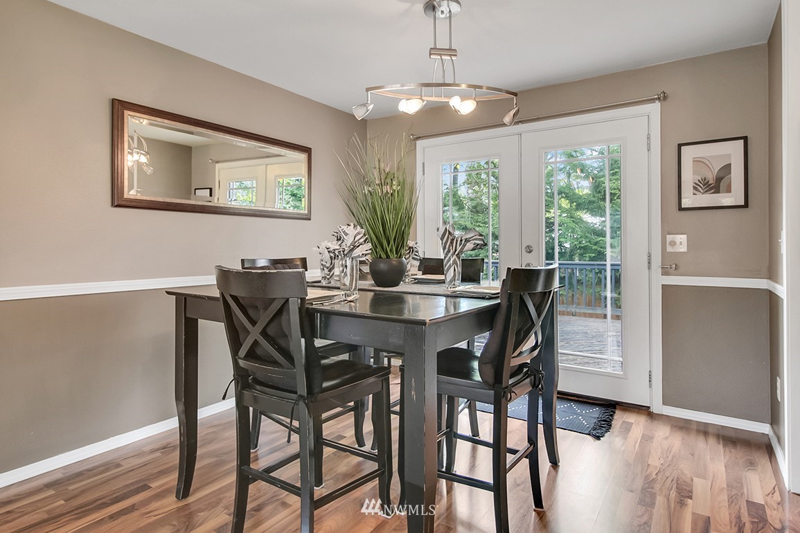 11811 Northeast 158th Street Bothell, WA 98011 - Photo 12 of 38 a view of a dining room with furniture window and wooden floor