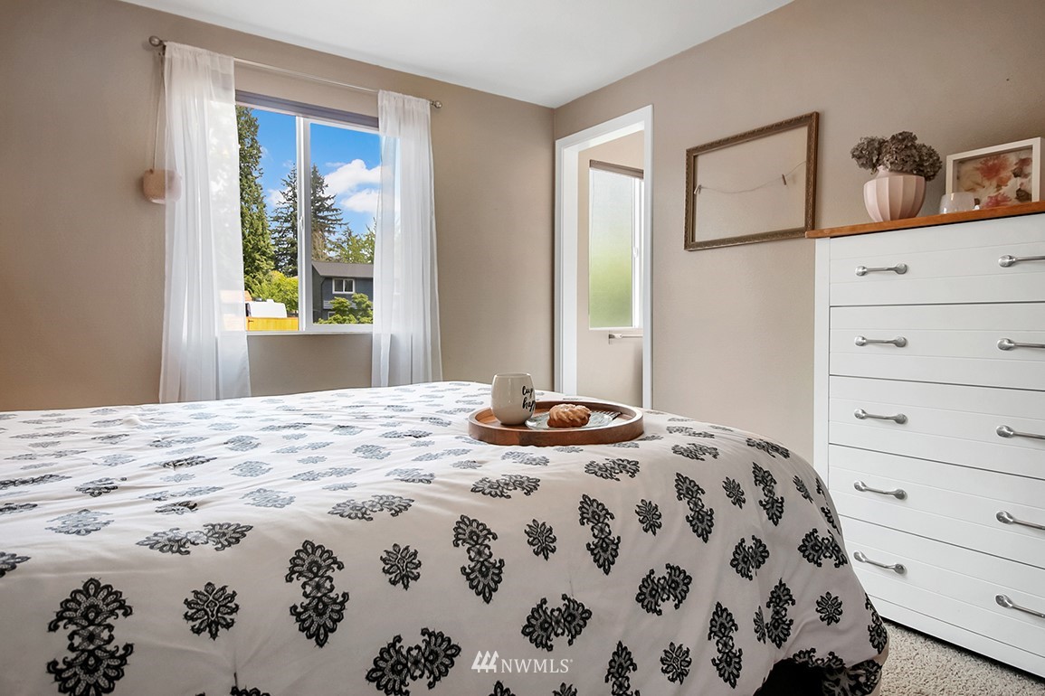 11811 Northeast 158th Street Bothell, WA 98011 - Photo 25 of 38 a bedroom with a bed and a window