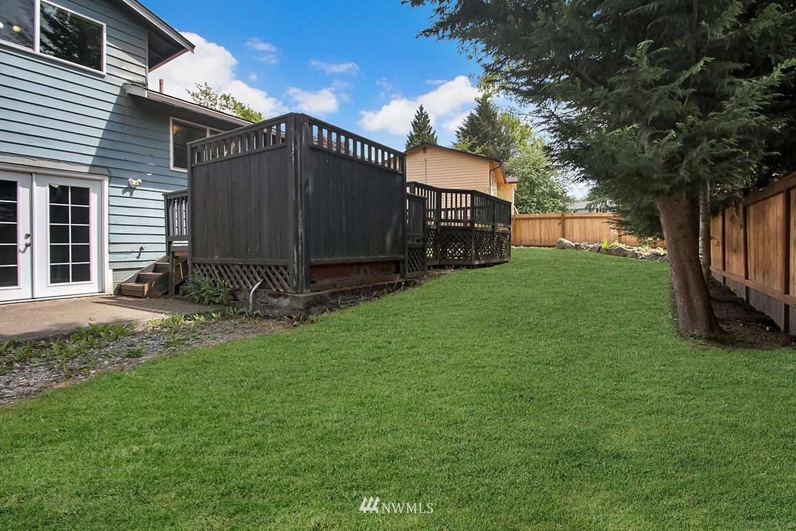 11811 Northeast 158th Street Bothell, WA 98011 - Photo 36 of 38 a view of a house with backyard and a tree