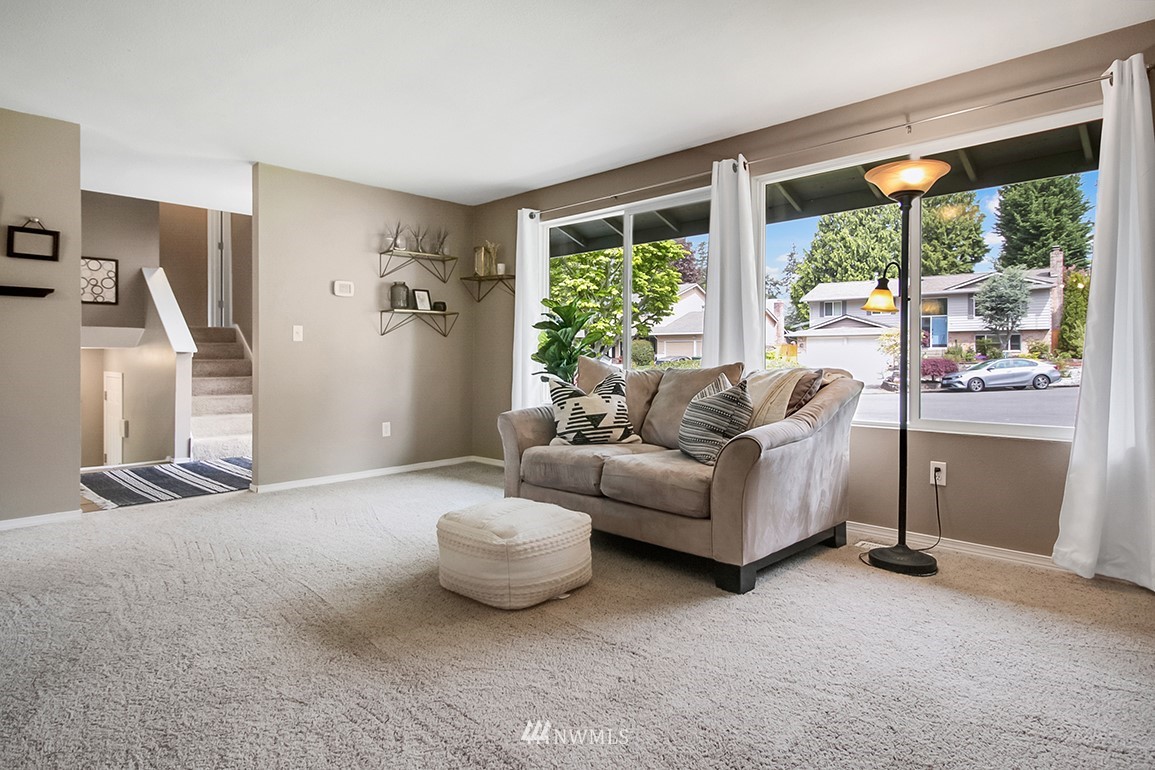 11811 Northeast 158th Street Bothell, WA 98011 - Photo 10 of 38 a living room with furniture and a floor to ceiling window