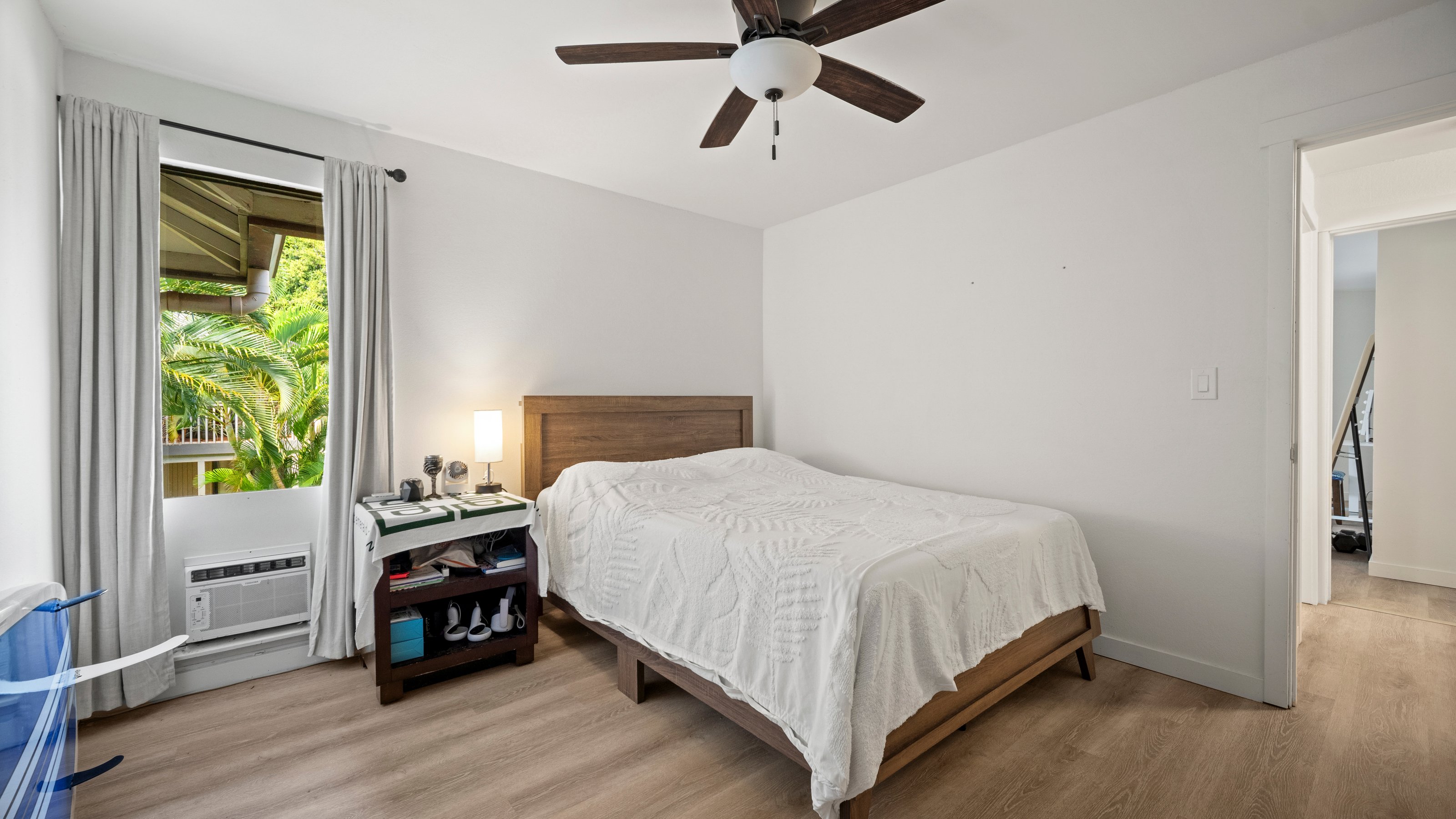 4121 Rice Street, Unit 2708 Lihue, HI 96766 - Photo 20 of 29 a bedroom with a bed and a window