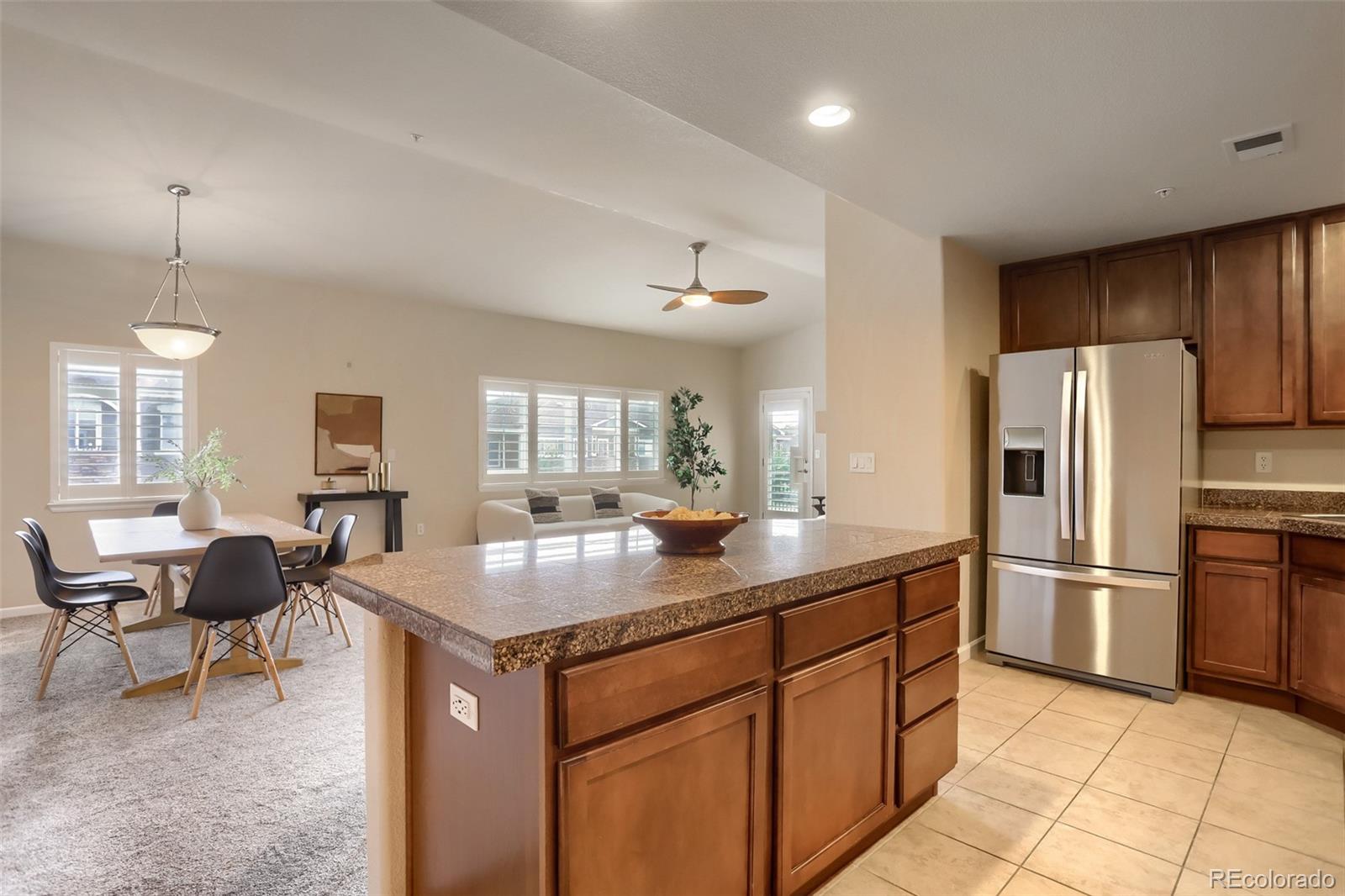 6232 Kilmer Loop, Unit 203 Golden, CO 80403 - Photo 13 of 33 a kitchen with refrigerator cabinets and furniture