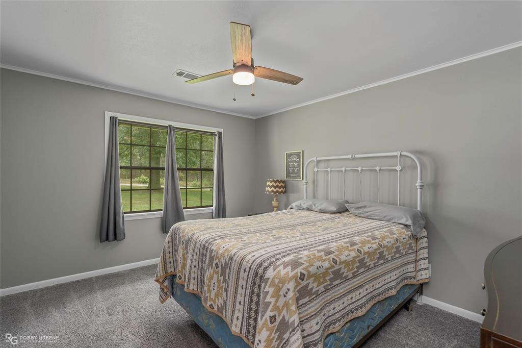 1426 Caney Lake Road Minden, LA 71055 - Photo 20 of 36 Spacious room featuring neutral grey walls and plush grey carpet flooring