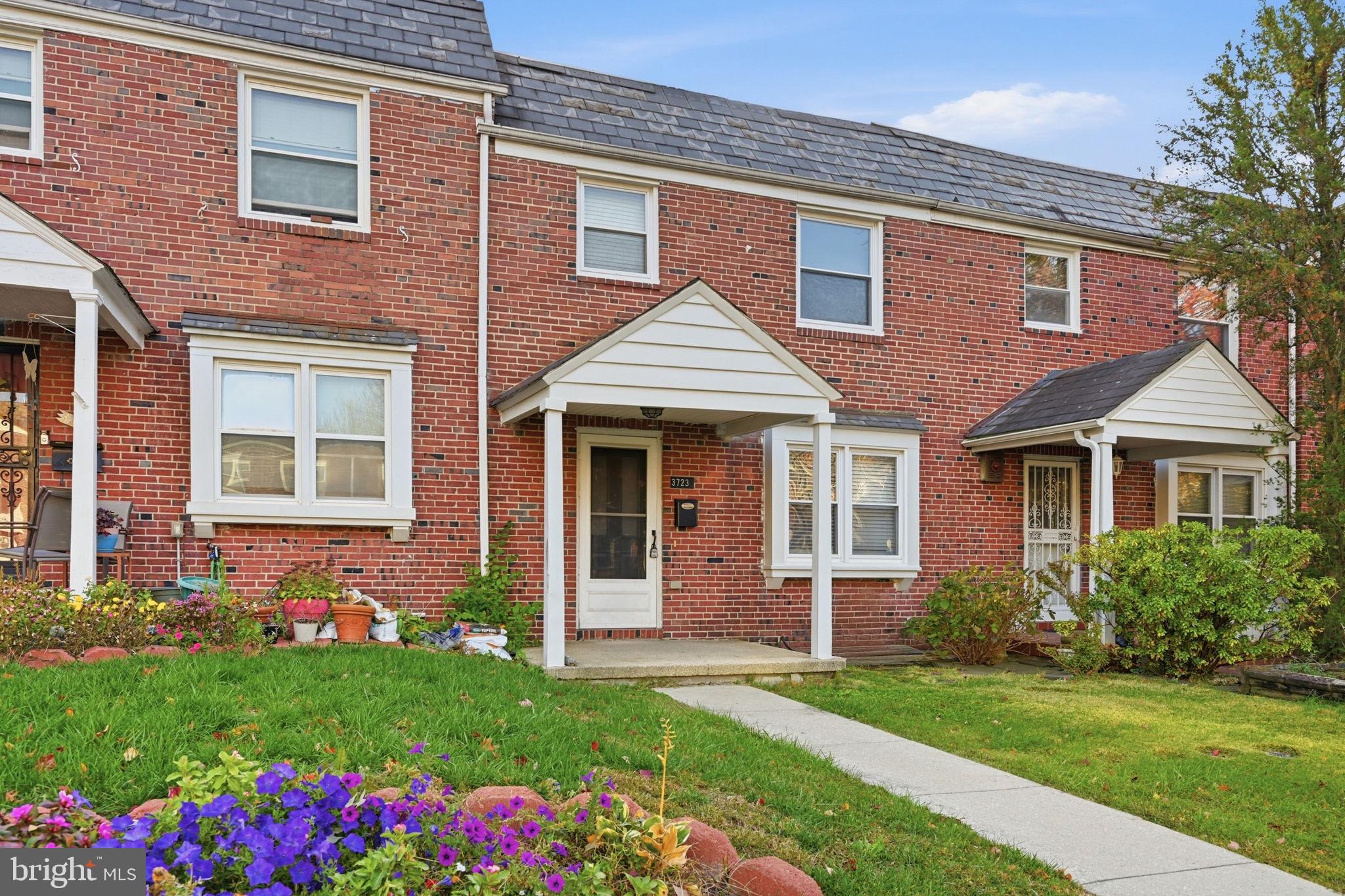 3723 Yolando Road Baltimore, MD 21218 - Photo 1 of 42 front view of a brick house with a yard
