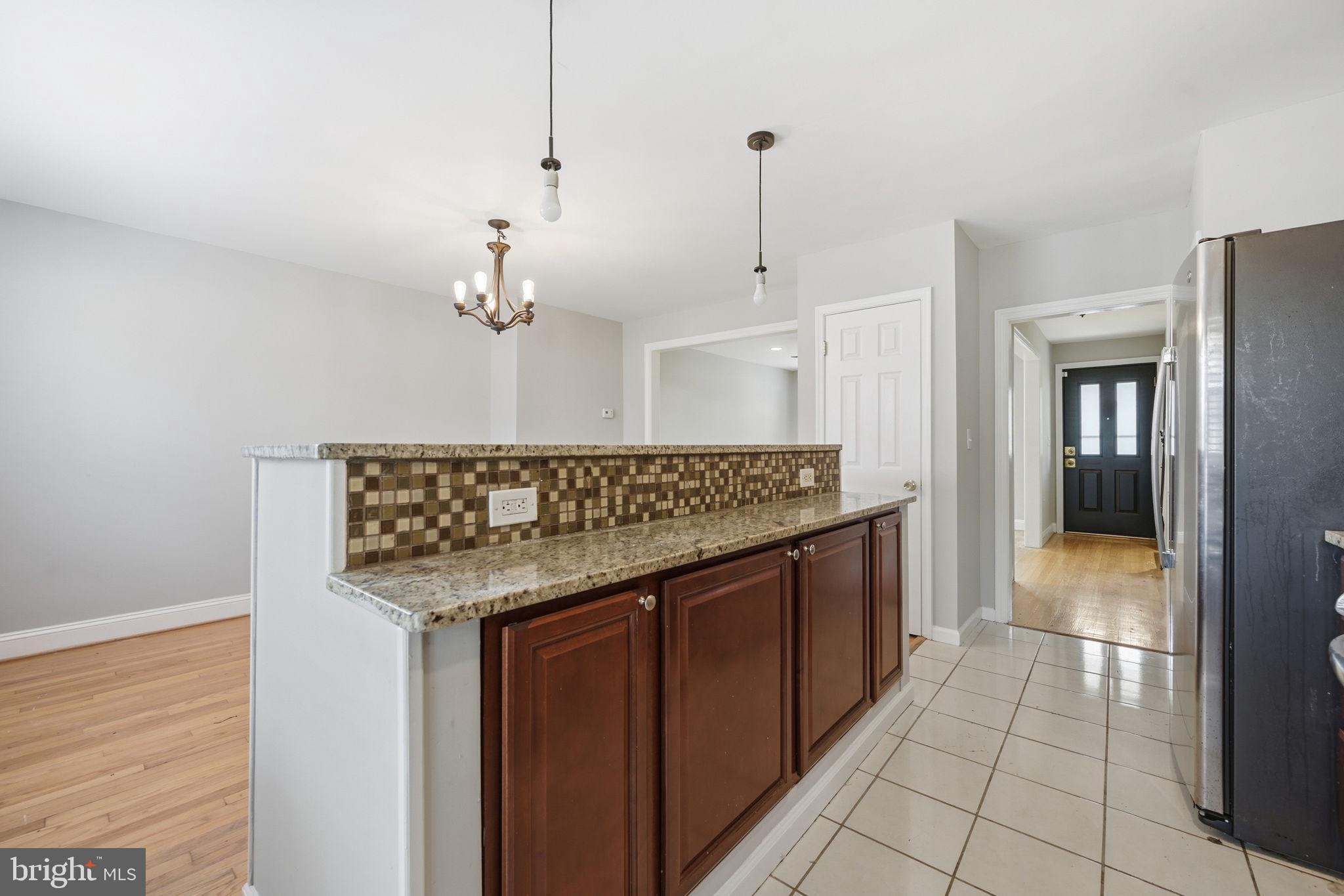 3723 Yolando Road Baltimore, MD 21218 - Photo 17 of 42 a kitchen with stainless steel appliances granite countertop a sink and cabinets
