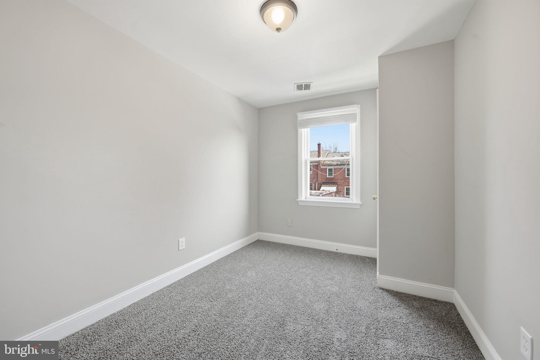 3723 Yolando Road Baltimore, MD 21218 - Photo 28 of 42 a view of an empty room with a window
