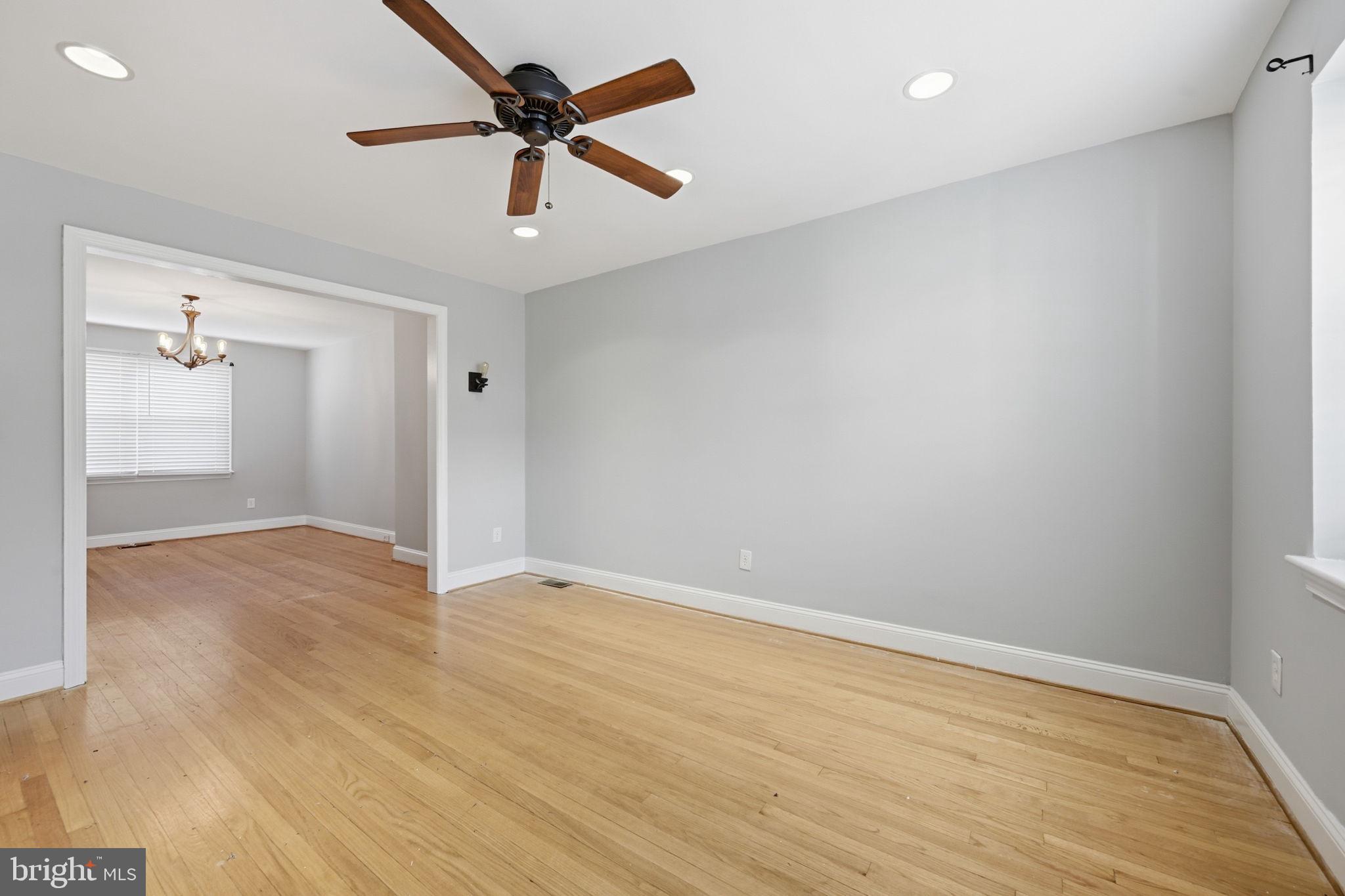 3723 Yolando Road Baltimore, MD 21218 - Photo 7 of 42 wooden floor in an empty room with a window