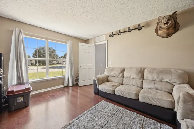 a kitchen with a sink cabinets and a window