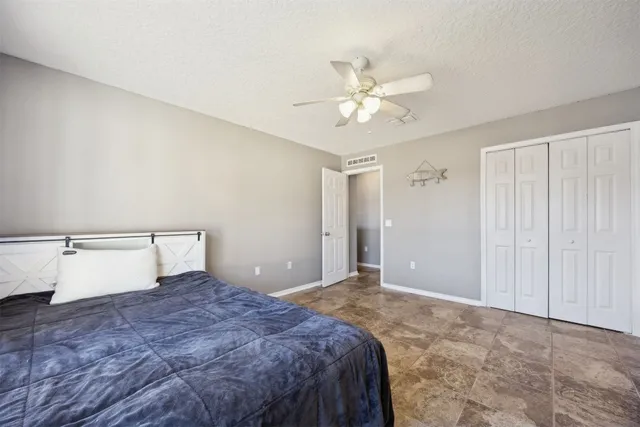 a living room with flat screen tv and a dresser