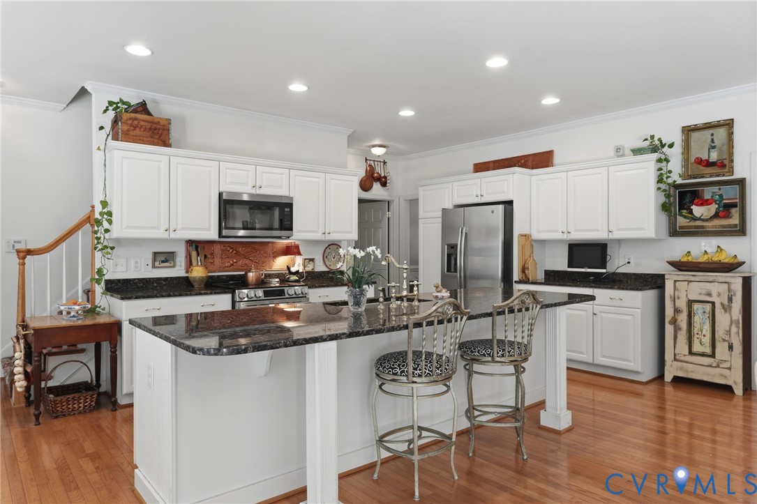 13424 Tipple Point Road Midlothian, VA 23114 - Photo 11 of 53 a kitchen with sink a microwave and cabinets
