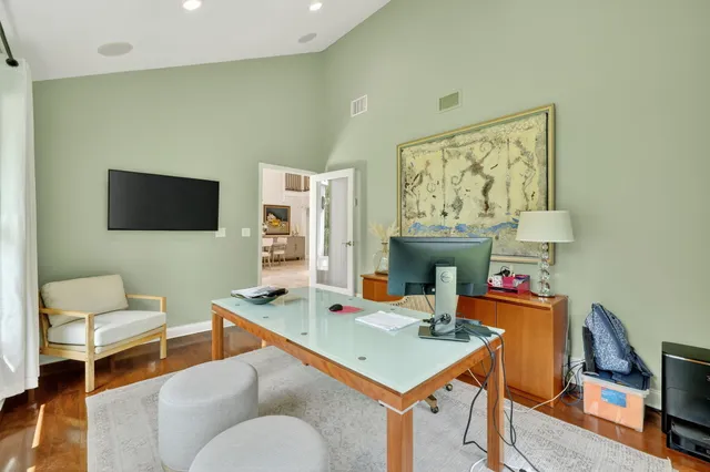 a kitchen with granite countertop kitchen island wooden cabinets and stainless steel appliances