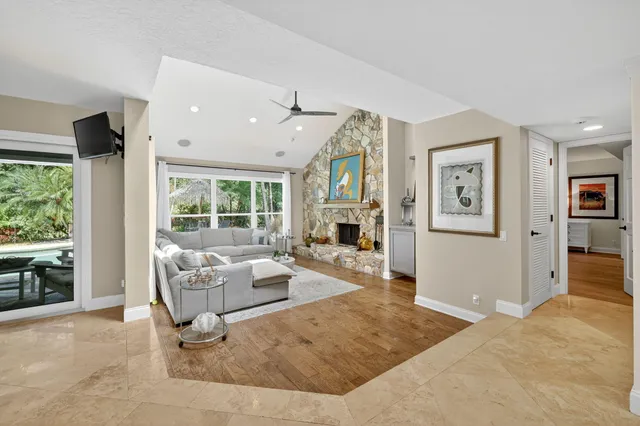 a large kitchen with stainless steel appliances granite countertop a stove and a sink