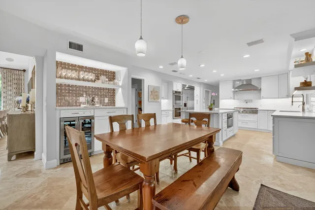 a bathroom with a double vanity sink a mirror and shower