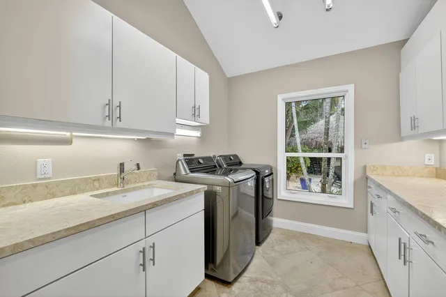 a living room with furniture and a ceiling fan