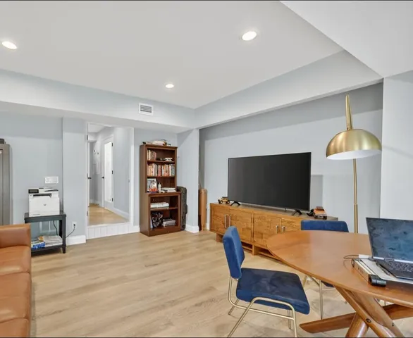 a view of a patio with dining table and chairs