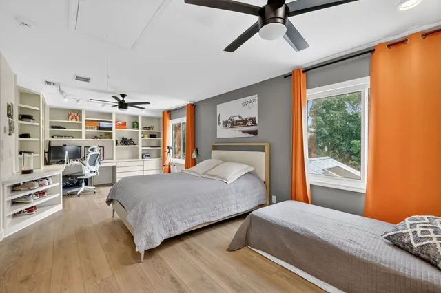 a view of a patio with chairs and plants