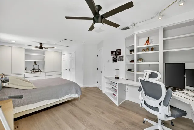a view of a patio with a table and chairs