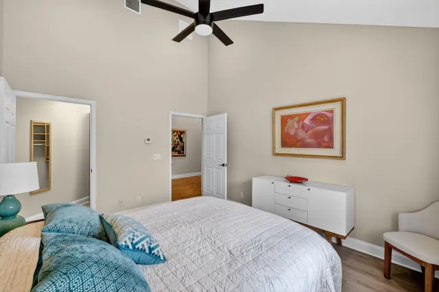 an aerial view of residential houses with outdoor space and trees