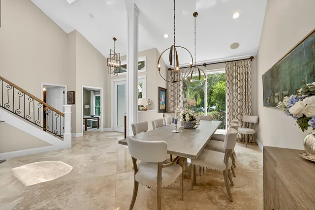 a view of a dining room with furniture window and outside view