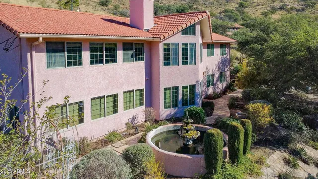 a aerial view of a house with a yard and plants