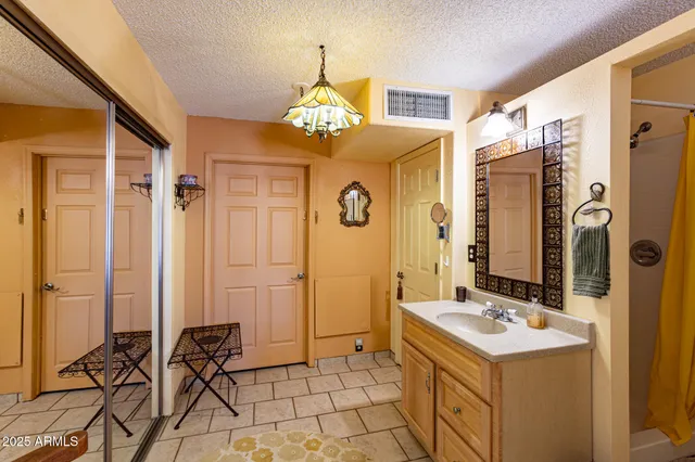 a living room with furniture a rug and a large window