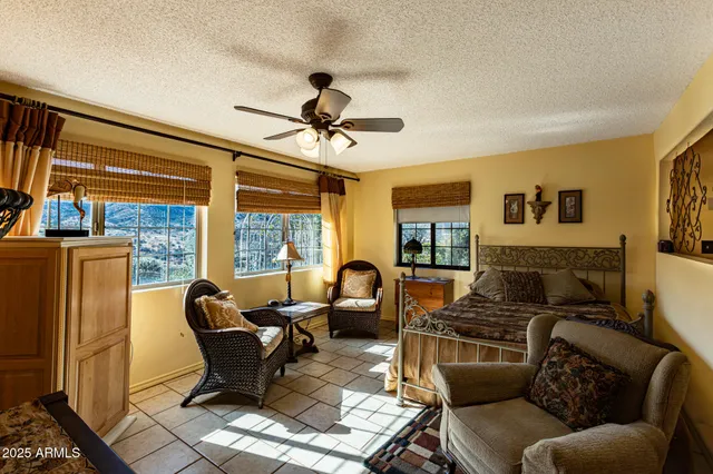 a front view of a house with outdoor seating