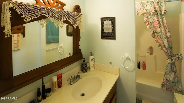 a view of a livingroom with workspace and a couch