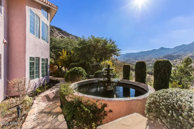 a backyard of a house with outdoor seating