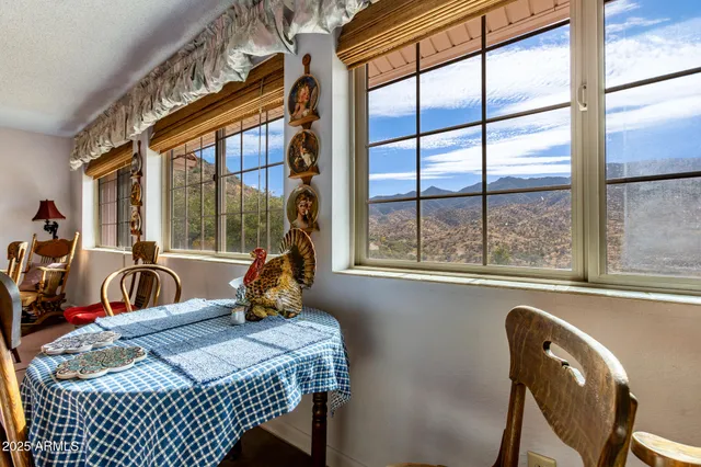 a living room with furniture a window and a flat screen tv