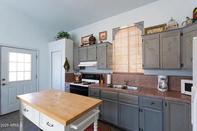 an aerial view of houses with yard