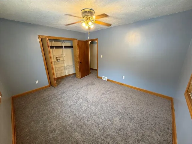 a bathroom with a sink mirror and a shower