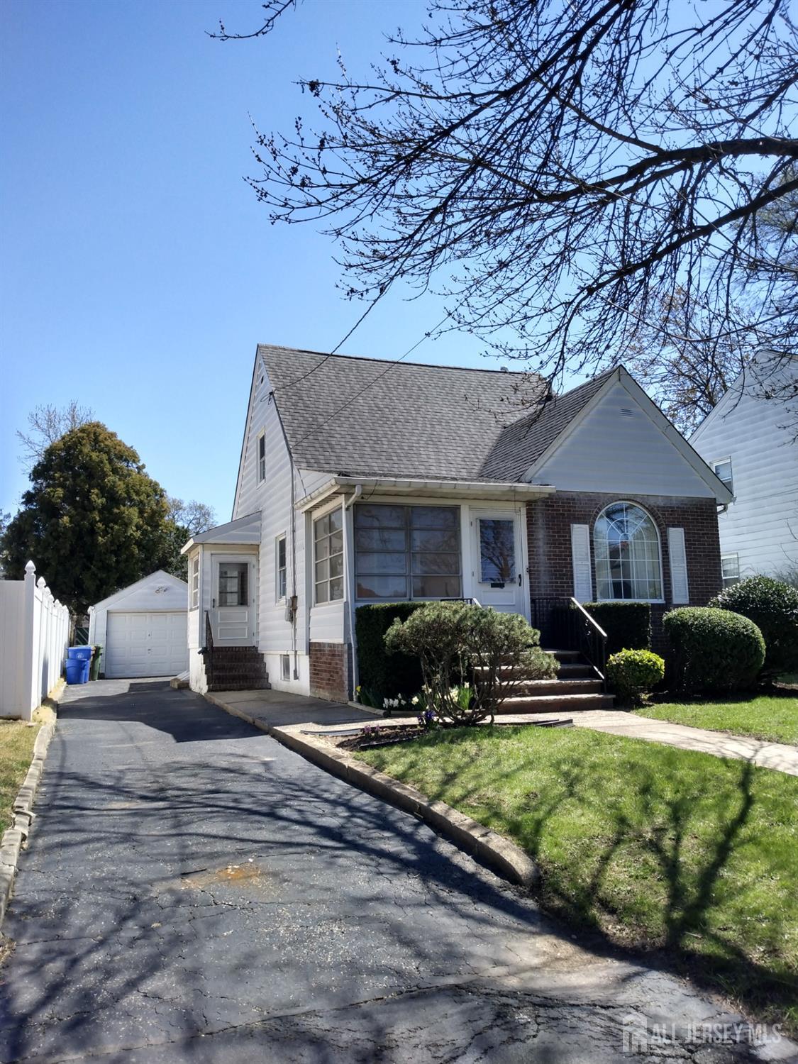 311 Hillside Road Linden, NJ 07036 - Photo 13 of 13 a front view of a house with a yard