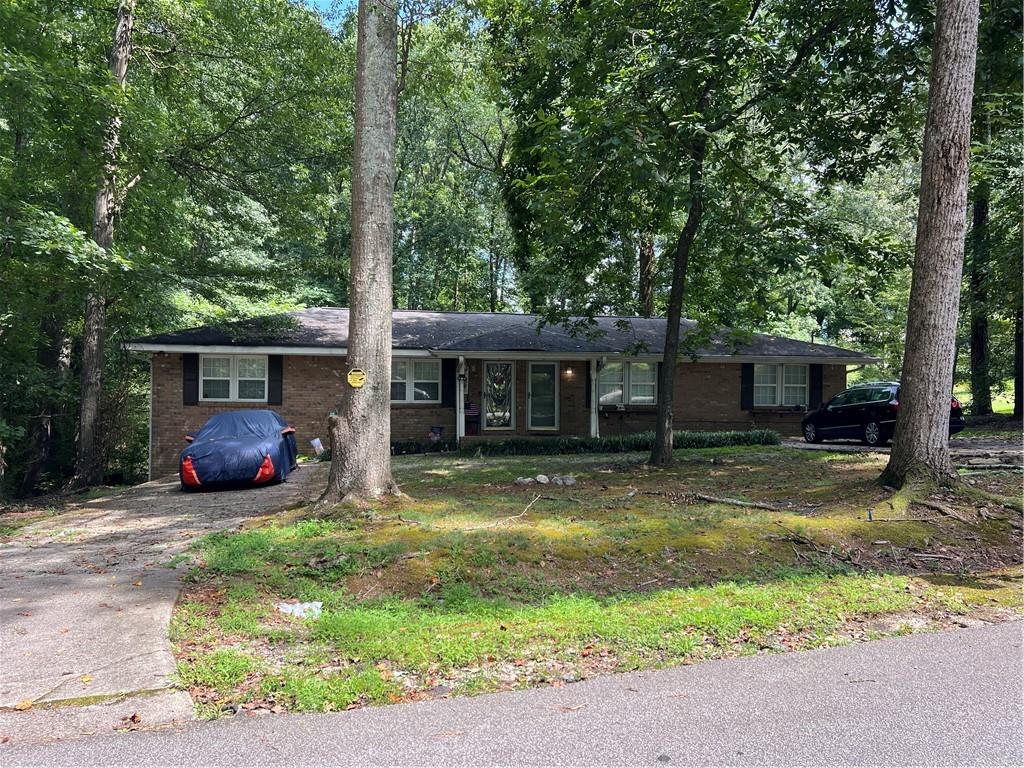 6660 Maxwell Drive Lithia Springs, GA 30122 - Photo 2 of 4 a view of a house with a yard and sitting area