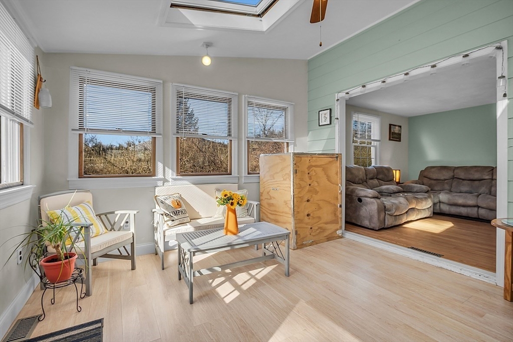 24 Edward Road Townsend, MA 01469 - Photo 11 of 38 a living room with furniture and a large window