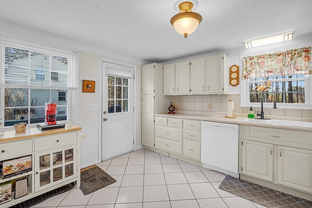 24 Edward Road Townsend, MA 01469 - Photo 17 of 38 a kitchen with stainless steel appliances cabinets a sink and a window