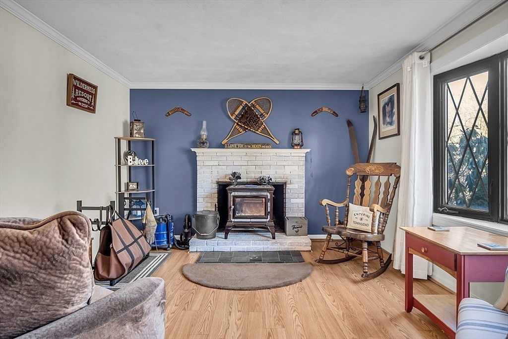 24 Edward Road Townsend, MA 01469 - Photo 2 of 38 a living room with furniture and a fireplace
