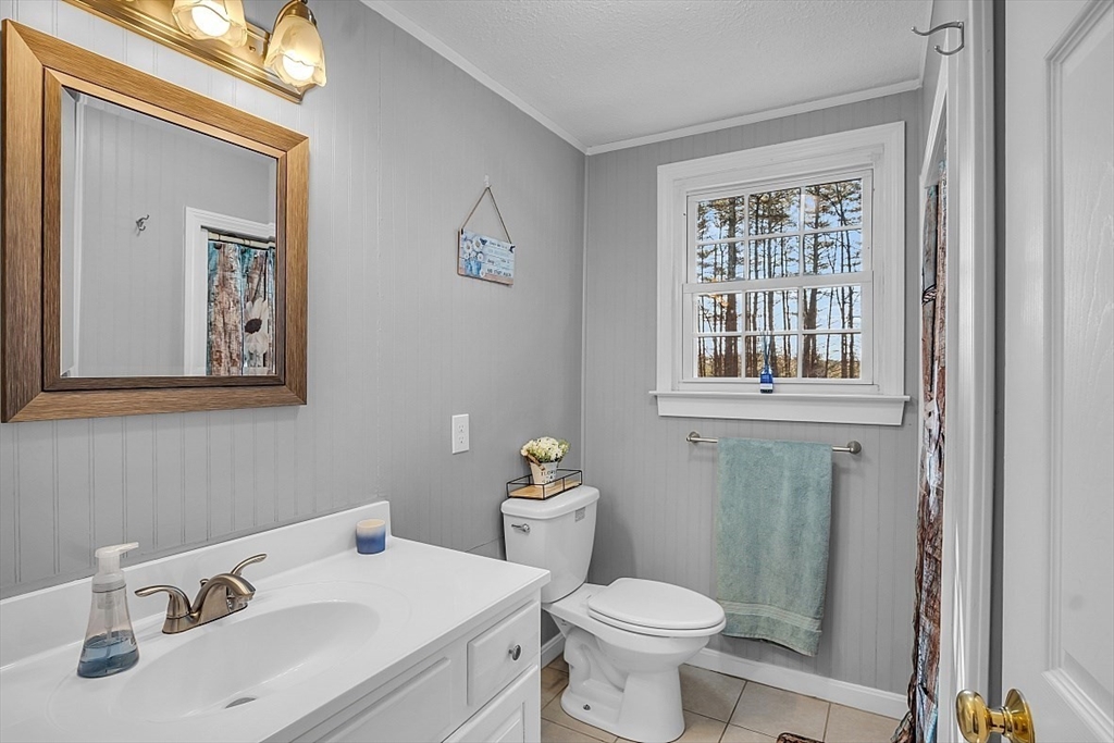 24 Edward Road Townsend, MA 01469 - Photo 24 of 38 a bathroom with a sink toilet and a mirror