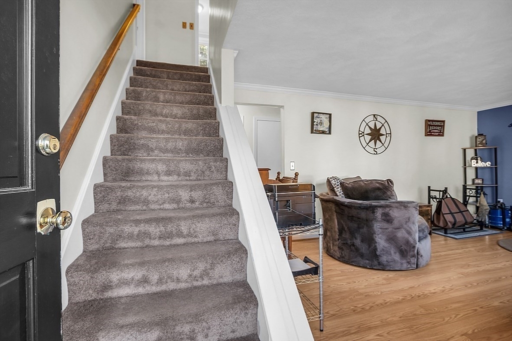 24 Edward Road Townsend, MA 01469 - Photo 26 of 38 a living room with furniture and stairs