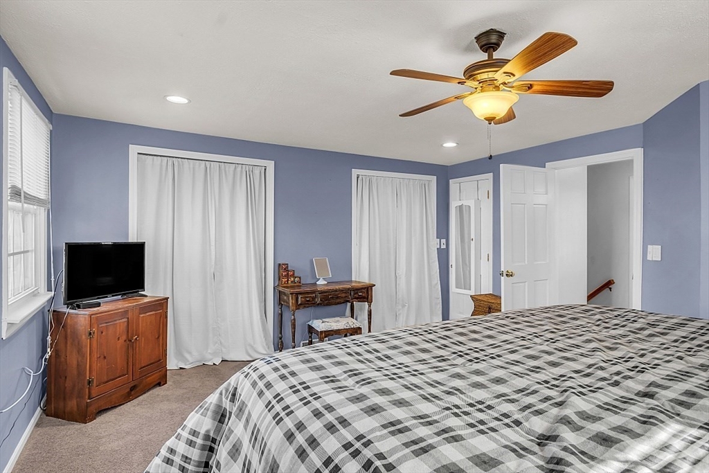 24 Edward Road Townsend, MA 01469 - Photo 29 of 38 a bedroom with a bed and a flat screen tv