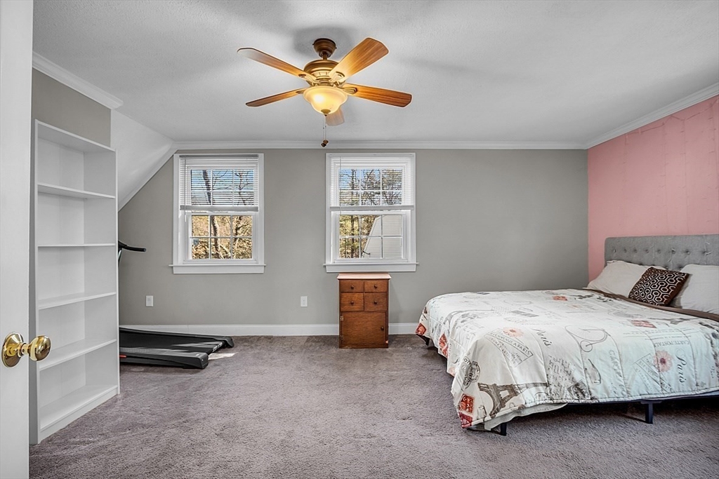24 Edward Road Townsend, MA 01469 - Photo 31 of 38 a bedroom with a bed and a chandelier