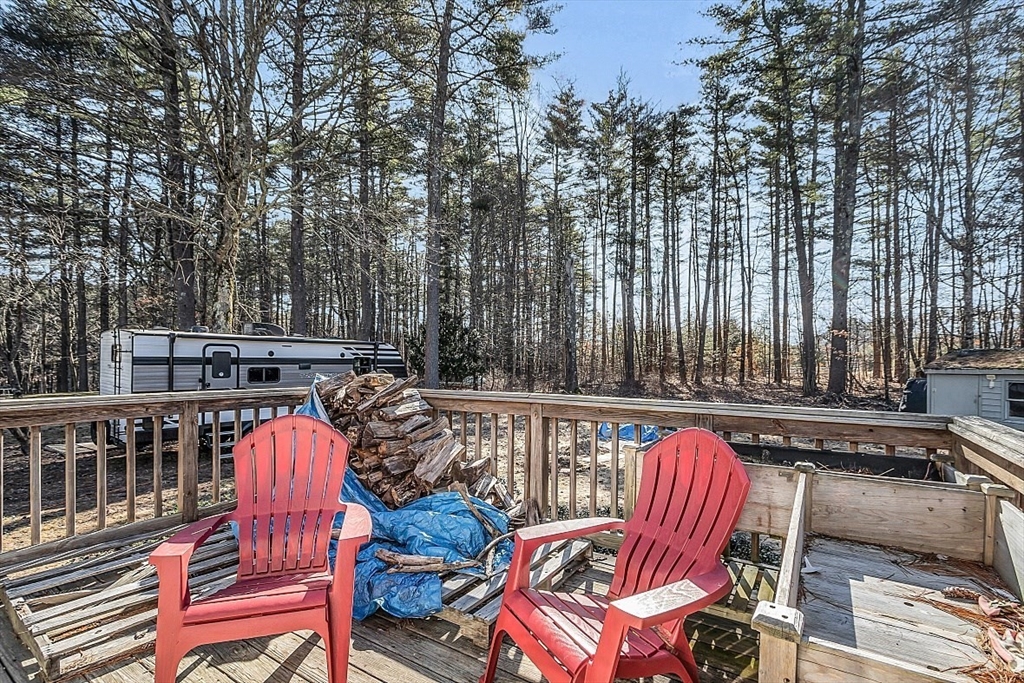 24 Edward Road Townsend, MA 01469 - Photo 37 of 38 a view of a patio with table and chairs with wooden floor and fence