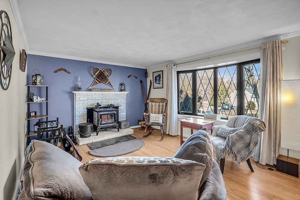 24 Edward Road Townsend, MA 01469 - Photo 5 of 38 a living room with furniture large window and a fireplace